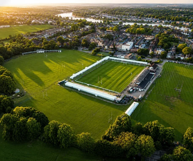 Aerial view of Old Deer Park Sports Ground in Richmond, home to MG Rehab, with surrounding sports pitches, green spaces, and nearby residential areas